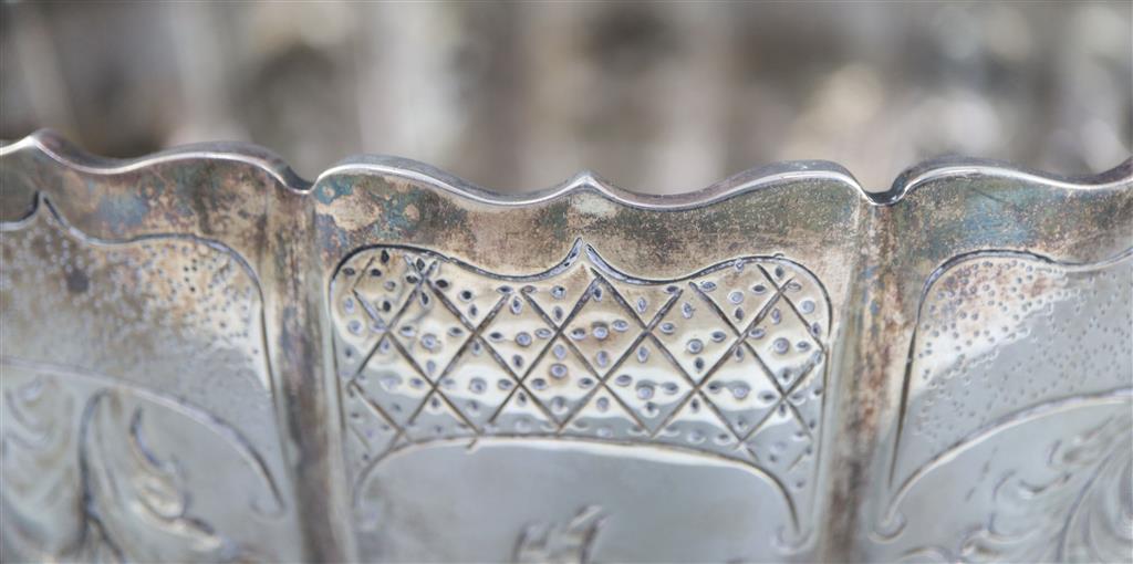 A late Victorian embossed silver presentation punch bowl, by Thomas of New Bond Street, London, 1890,
